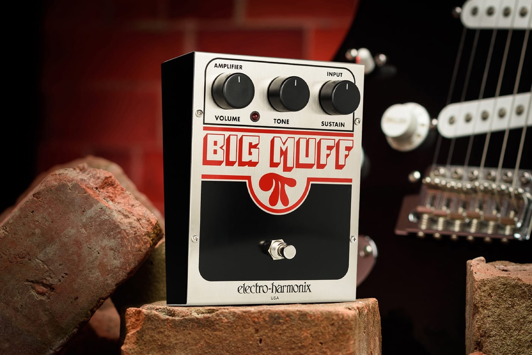 Electro-Harmonix Big Muff Pi fuzz pedal on a wooden bench
